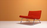 red armchair and orange wall