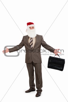 Businessman in suit with santa hat on head