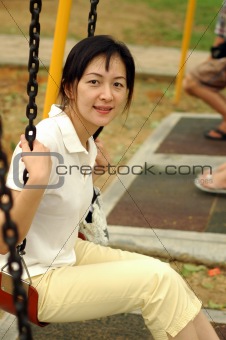 Chinese lady on swing