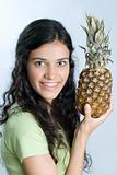 girl holding pineapple