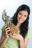 girl holding pineapple