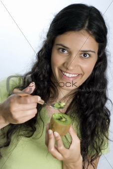 girl eating kiwi