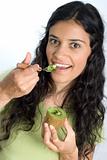 girl eating kiwi