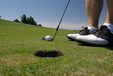 Golfer lining up a putt