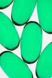 Green pill capsules.