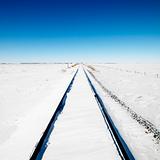 Snow covered railroad tracks.