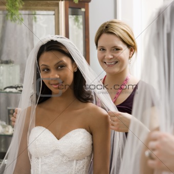 Seamstress helping bride.