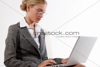 Beautiful business woman working on her laptop