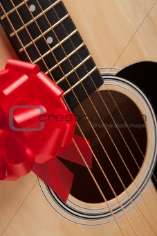 Guitar Strings with Red Ribbon - The Gift of Music.