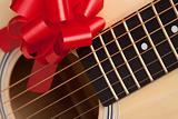Guitar Strings with Red Ribbon - The Gift of Music.