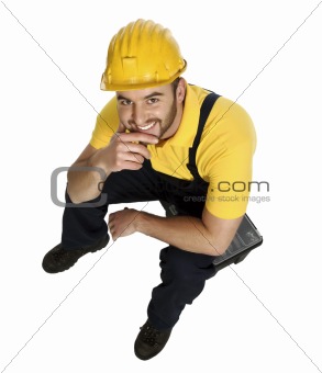 smiling manual worker rest on toolbox