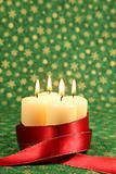 Candles with ribbon on Christmas background