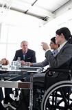 Businesswoman in a wheelchair during a meeting