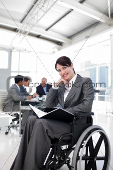 Portrait of a smiling businesswoman in a wheechair