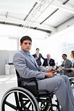 Young businessman in a wheelchair