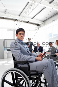 Young businessman in a wheelchair