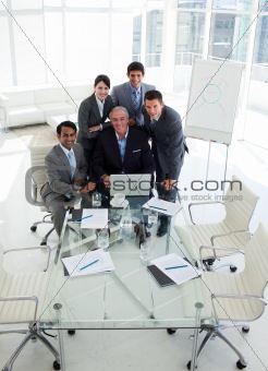 A business group showing diversity working at a computer