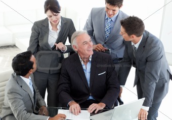 Confident business team discussing a contract