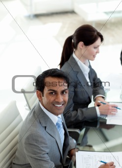 Ethnic businessman smiling at the camera