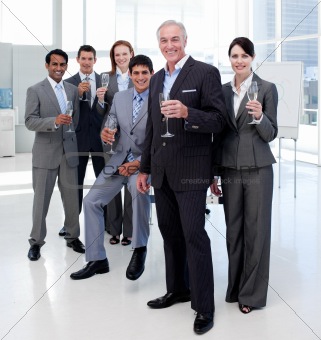 Multi-ethnic business people toasting with Champagne