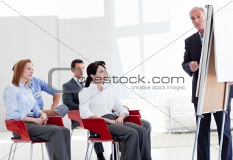 Multi-ethnic business people at a seminar 