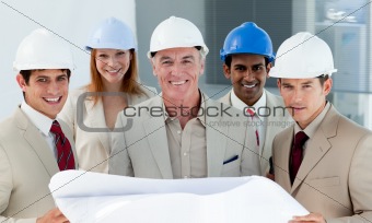 Architects with hardhats in a building site
