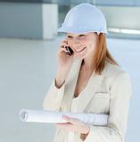 Young female engineer on phone