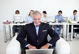 Senior businessman using a laptop