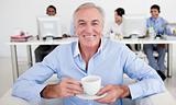 Senior businessman drinking a coffee 