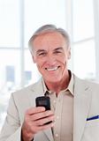 Senior businessman using a mobile phone
