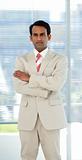 Confident ethnic businessman with folded arms