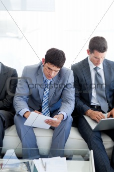 Concentrated Business people sitting and waiting for a job inter