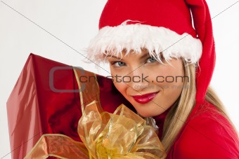 Attractive Santa girl with present