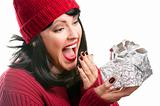 Happy, Attractive Woman Holds Holiday Gift Isolated on a White Background.