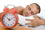 Man Asleep with Clock