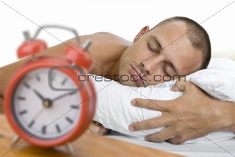 Man Asleep with Clock