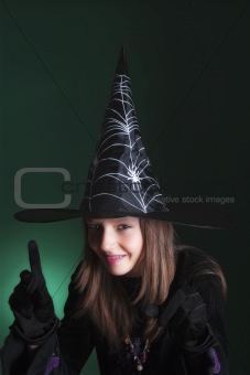 portrait of an eleven years old girl dressed as a witch 