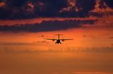 silhouette of a landing plane