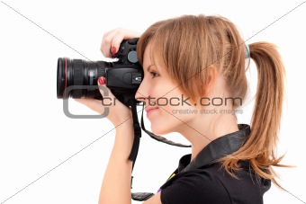 Pretty woman making photograph. Side view