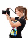 Young woman checking photo camera