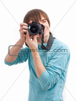 Young man making photo. Front view