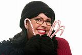 Pretty Woman Holding Candy Canes Isolated on a White Background.