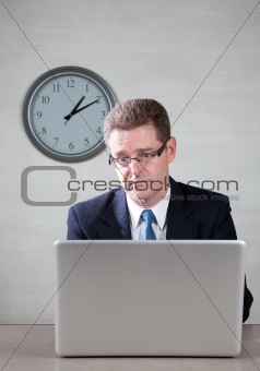 Bored man on laptop computer
