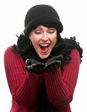 Excited Woman In Winter Clothes Holds Her Hands Out Isolated on a White Background.