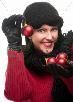 Attractive Woman Holding Christmas Ornaments Isolated on a White Background. 