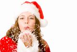 Santa Claus woman is blowing Christmas snow
