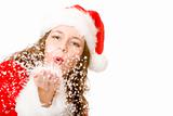 Santa Claus woman is blowing Christmas winter snow