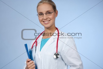Beautiful female doctor with clipboard