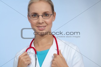 Close-up of a beautiful young doctor smiling