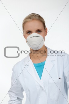 Young female doctor wearing a protecting mask